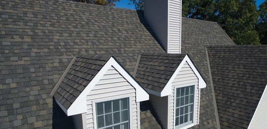 house with new shingle roofing